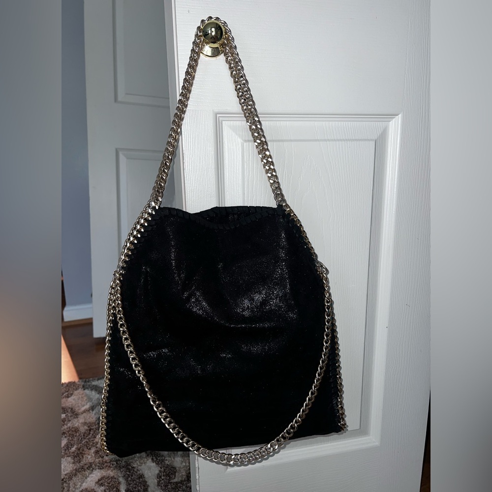 Black suede and gold over the shoulder bag